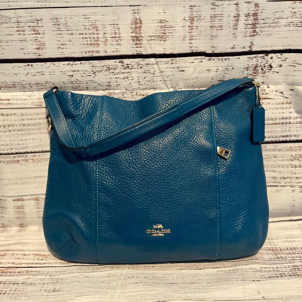 Coach: Royal Blue purse with gold hardware